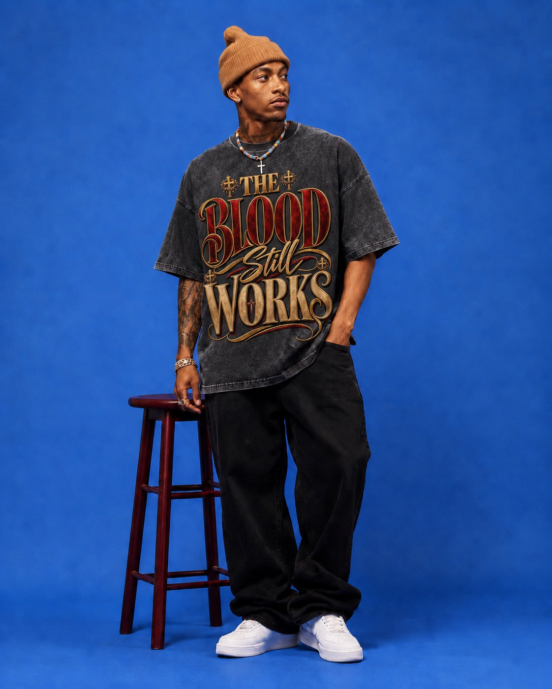 The Blood Still Works charcoal tee on male model